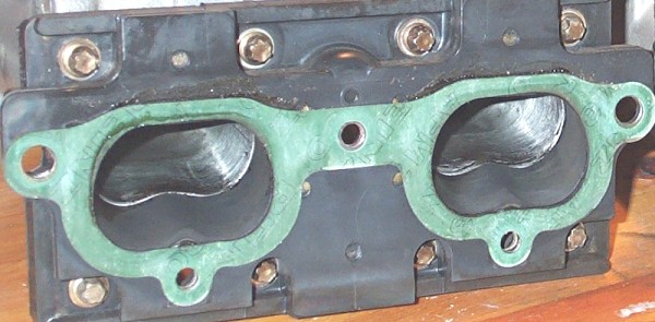 E28 M5 paper throttle body gaskets installed on an isolator