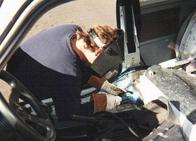 Sean McLean welds in a baseplate